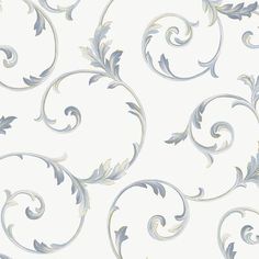 a white wallpaper with silver swirls on it