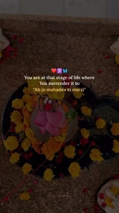 an image of flowers and candles on the ground with a quote about life where you are at that stage of life