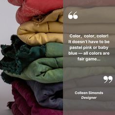 a stack of folded clothes with a quote about color