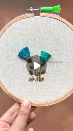 Shalu | Gossamer on Instagram: "Have you ever tried out Tassels Embroidery?

If no, do check out me YouTube channel “Embroidery by Gossamer” for detailed tutorial of the Tassel flowers 🌷 

This pattern contains two tassel flowers and a tiny French Knot Garden flower. This is a simple pattern that can easily be done by beginners. 

Checkout the highlights for link to the video, or just search “Tassel flowers embroidery by Gossamer” 😇

#tassel #tassels #tasselflower #embroidery #embroideryforbeginners #learnembroidery #embroiderybygossamer #bordados #flowerembroidery" Tassels Embroidery, Knot Garden, Tassel Embroidery, Thistle Flower, Flowers Embroidery, Learn Embroidery, French Knot, Embroidery For Beginners, Garden Flower