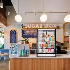 the inside of a sugar fox restaurant with lots of counter space