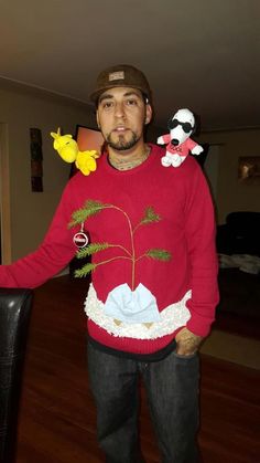 a man in a red sweater with fake flowers on his chest