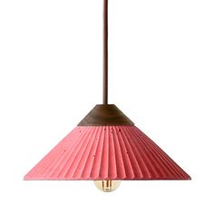 a pink and brown light hanging from a ceiling fixture with a wooden handle on the end