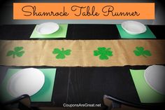 the table runner is decorated with green shamrocks and place mats for st patrick's day