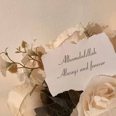 there is a white flower with a sign on it that says, ahandadullillah always and forever