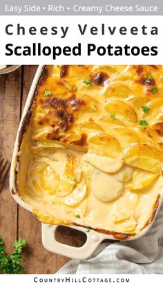 a casserole dish with potatoes and cheese in it on a wooden table next to parsley