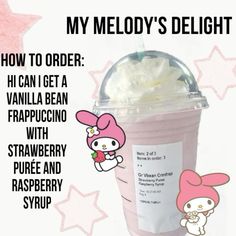 a pink drink with whipped cream in it and hello kitty on the side, sitting next to a strawberry raspberry syrup