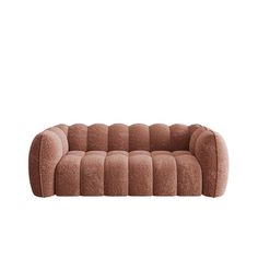 a brown couch sitting on top of a white floor