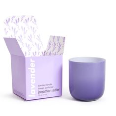 the lavender candle is next to its box