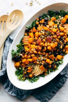 a white bowl filled with carrots and other vegetables