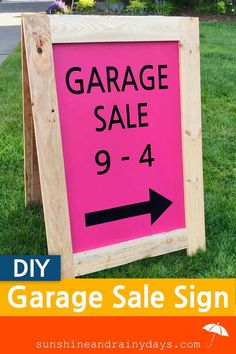 a pink garage sale sign with an arrow pointing to the right in front of it