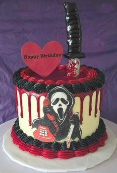 a birthday cake with a knife and skull on it