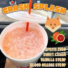 a person holding up a drink in front of a car with the words crash splash on it