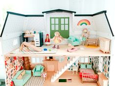 a doll house with furniture and accessories inside