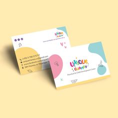 two business cards with colorful shapes on the front and back, one for children's clothing