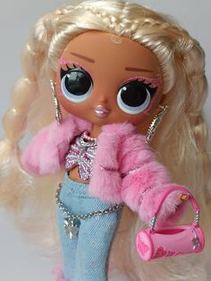 a doll with blonde hair and big eyes is holding a pink purse in her hand