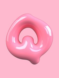 a pink donut on a pink background is shown in the shape of a spiral