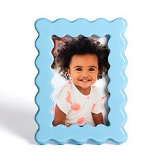 Our Blue Wavy Layer Picture Frame will showcase any special memory with cute, whimsical charm. You'll adore its bright blue hue and fun, wiggly shape! Frame measures 5.5L x 0.6W x 7.5H in. Crafted of MDF with a lacquer finish Blue finish Wavy frame design Holds one (1) 4x6 photo Easel back for tabletop display Care: Dust with a soft, dry cloth. Contact your local Kirkland's store for availability. Quantities and selection may vary by location. Sold in stores under item number 313354. | Wavy Layer Picture Frame, 4x6, Blue, 4x6 | Kirkland's Home Layer Pictures, Wavy Frame, Wavy Layers, Tabletop Display, 4x6 Photo, Table Top Display, Blue Hues, Bright Blue, Item Number