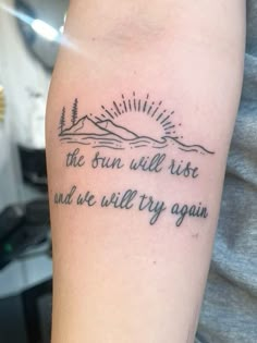 the sun will rise and we'll try again on someones left arm tattoo