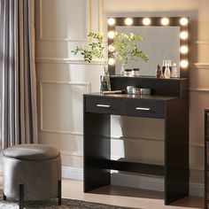 a dressing table with lights on it and a stool in front of the vanity mirror