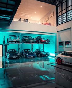 there are many cars on the shelves in this garage, and one car is blue