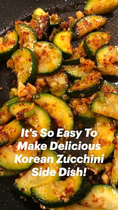 zucchini being cooked in a skillet with seasoning