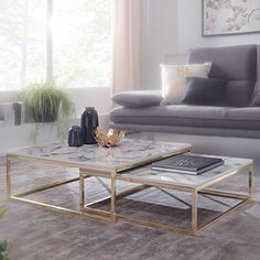 a living room with a couch, coffee table and other items on the carpeted floor