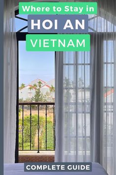 an open window with the words where to stay in hoian vietnam complete guide on it