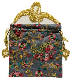 a gray purse with gold chains and flowers on it