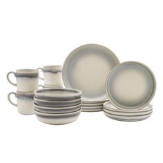 a white and grey dinner set with dishes