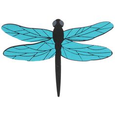 a blue dragonfly sitting on top of a white surface