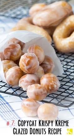 several glazed donuts on a cooling rack with the words copycat krispy kreme glazed donuts recipe