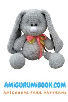 a gray crocheted stuffed animal sitting on top of a white background with the words amigurum book com written below it