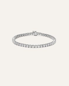 Elevate your everyday elegance with our stunning lab grown diamond tennis bracelet, featuring a classic 4-prong design that showcases each stone's brilliance. Available in two lengths and five different total carat weight options, this bracelet allows you to customize your perfect fit and desired level of sparkle. The secure box clasp with safety closure ensures your precious piece stays firmly in place, making it ideal for daily wear without worry. Place Making, Everyday Elegance, Diamond Tennis Bracelet, Box Clasp, Tennis Bracelet Diamond, Tennis Bracelet, Quince, Lab Grown, Lab Grown Diamonds