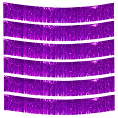 purple tinsel fringes are lined up against a white background with no one in the photo