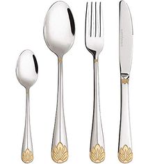 an assortment of silverware including forks, knives and spoons with gold designs on them