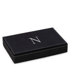 a black box with the letter w on it's front and side, sitting on a white surface