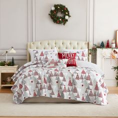 a christmas themed bed with red and white decorations