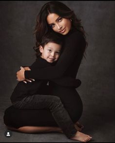 a woman and child posing for a photo