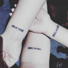 two people with matching tattoos on their arms that say one of three, while the other says