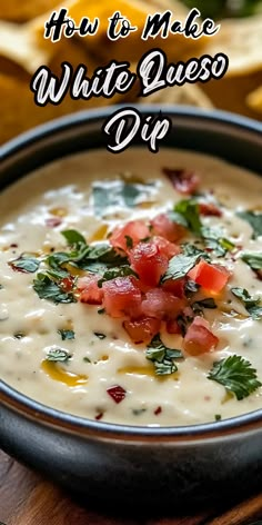 white quesadilla dip in a black bowl with cilantro and tomatoes