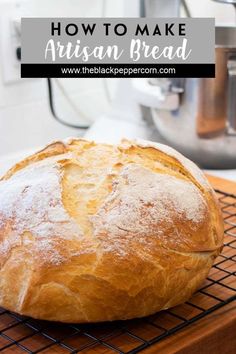 a loaf of bread sitting on top of a cooling rack with the words how to make artisan bread