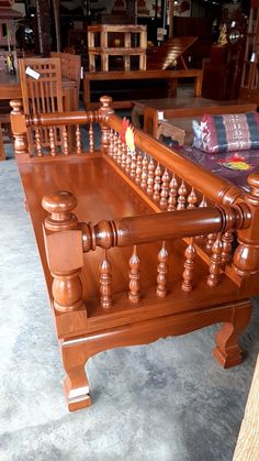 a large wooden bed frame sitting on top of a floor