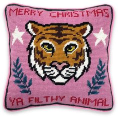 a pink pillow with a tiger on it's face and the words merry christmas ya filthy animal