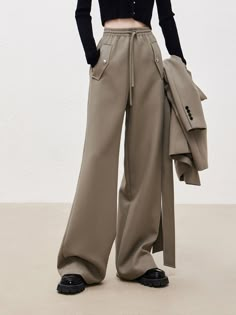 MO&Co.Women Wool Blend Drawstring Casual Pants Features : - Wool blend- Loose straight trousers- Double side pocket design- Drawstring elastic waistband Code: MBB4PATT07The length of size M is 106cm MATERIALS & CARE : Material: 51.6% Polyester 48.4% WoolDo not wash, do not bleachHang to dry, do not tumble dryLow-temperature ironing, professional dry cleaningDo not put the sun under long exposureNote: Wrap metal parts before dry cleaningPlease select your own size in the size chart according to y Elastic Waistband Pants, Sporty Casual, Embroidery On Clothes, Straight Trousers, Long Exposure, 가을 패션, Lookbook Outfits, Drawstring Pants, Straight Pants