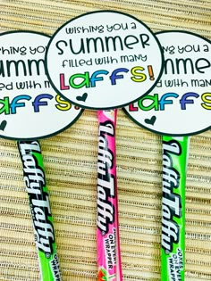 three personalized candy lollipops sitting next to each other on a table