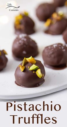 chocolate covered pistachio truffles on a white platter with the title