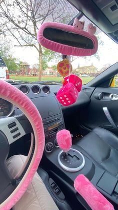 the interior of a car is decorated with pink decorations