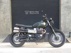 a motorcycle parked in front of a garage door