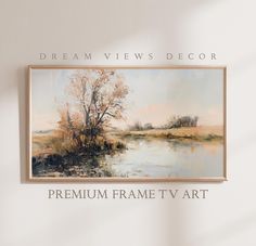 a painting hanging on the wall above a water way with words below it that read, dream views decor premium frame tv art